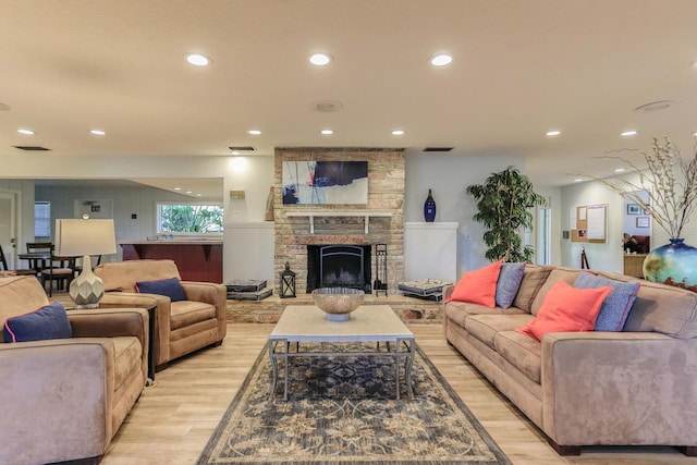 470 Oak Haven Dr Unit 470, Altamonte Springs, FL 32701 - living room with light wood finished floors, recessed lighting, and a fireplace