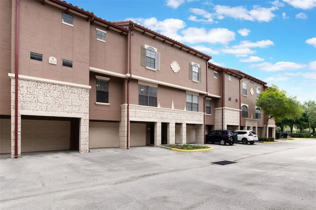 view of building exterior with an attached garage