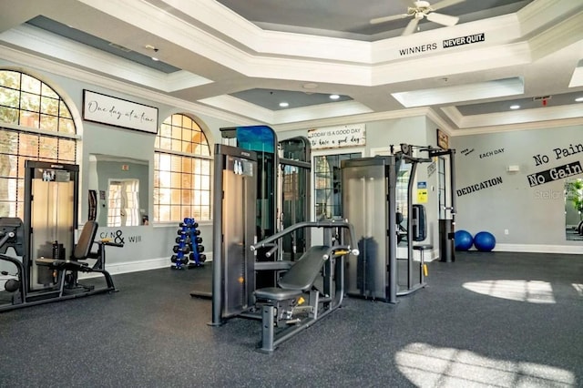 workout area with crown molding, ceiling fan, and baseboards