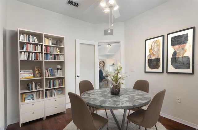6107 Metrowest Blvd Unit 104, Orlando, FL 32835 - dining space featuring ceiling fan, baseboards, and dark wood-type flooring