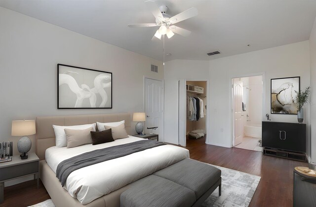 6107 Metrowest Blvd Unit 104, Orlando, FL 32835 - bedroom with wood finished floors, a closet, a spacious closet, and ensuite bath