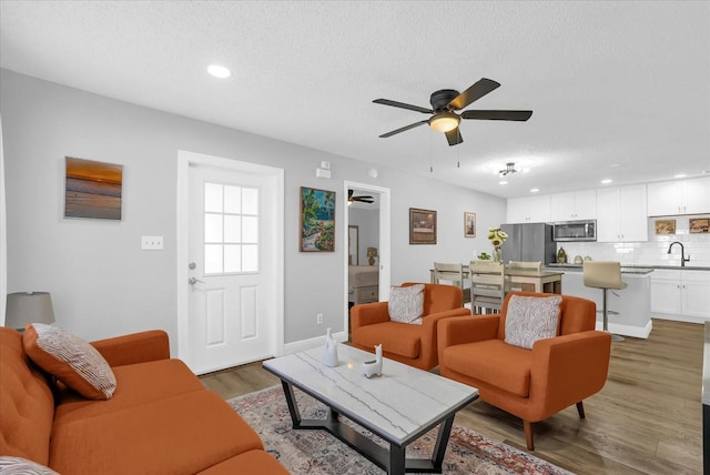 508 Boxelder Ave, Altamonte Springs, FL 32714 - living area with a ceiling fan, a textured ceiling, wood finished floors, recessed lighting, and baseboards