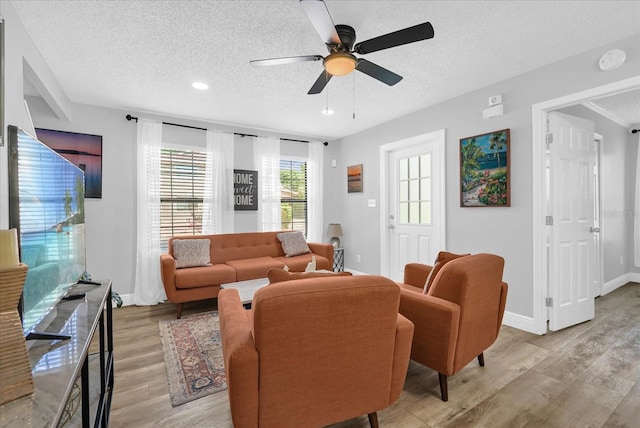 508 Boxelder Ave, Altamonte Springs, FL 32714 - living room with a textured ceiling, light wood-style flooring, a ceiling fan, baseboards, and recessed lighting