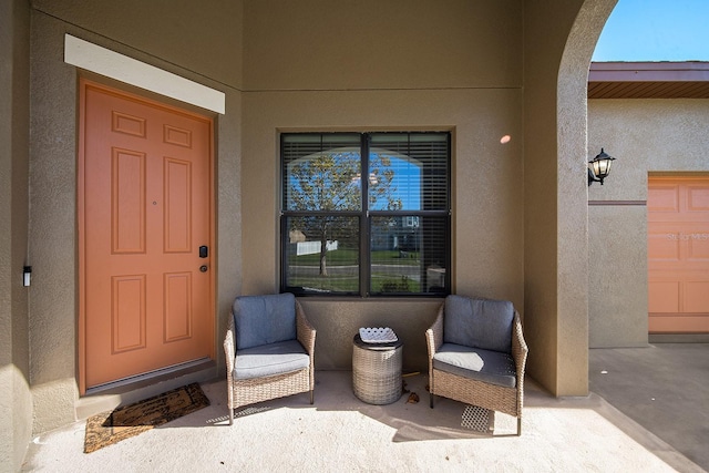entrance to property with stucco siding