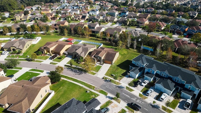 aerial view of property and surrounding area with nearby suburban area
