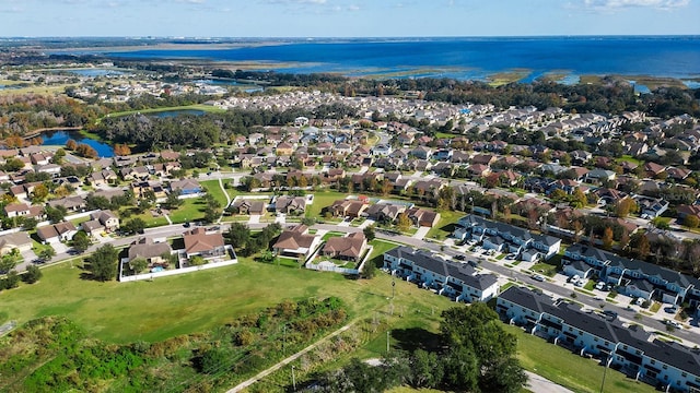 aerial overview of property's location featuring a large body of water and nearby suburban area