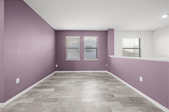 empty room with baseboards