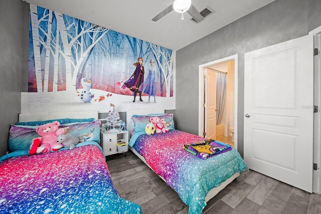 bedroom featuring wood finished floors and ceiling fan