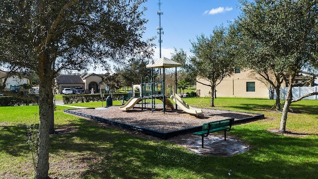 communal playground featuring a yard