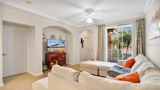 12220 Wild Iris Way Unit 103, Orlando, FL 32837 - living area with arched walkways, light wood finished floors, ornamental molding, a ceiling fan, and baseboards