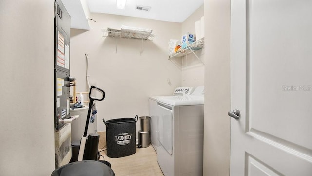 12220 Wild Iris Way Unit 103, Orlando, FL 32837 - laundry area with independent washer and dryer and light wood finished floors