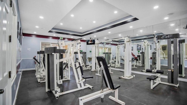 12220 Wild Iris Way Unit 103, Orlando, FL 32837 - workout area with a tray ceiling, recessed lighting, and baseboards