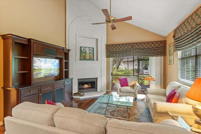 3987 Lancashire Ln Unit 3987, Longwood, FL 32779 - living area with dark wood-style flooring, a ceiling fan, high vaulted ceiling, and a fireplace