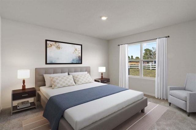 carpeted bedroom featuring baseboards and recessed lighting