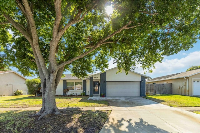 1804 W Shores Rd, Melbourne, FL 32935 - ranch-style home featuring an attached garage, concrete driveway, and brick siding