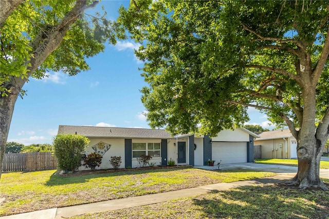 1804 W Shores Rd, Melbourne, FL 32935 - view of front of house featuring a garage, driveway, and stucco siding