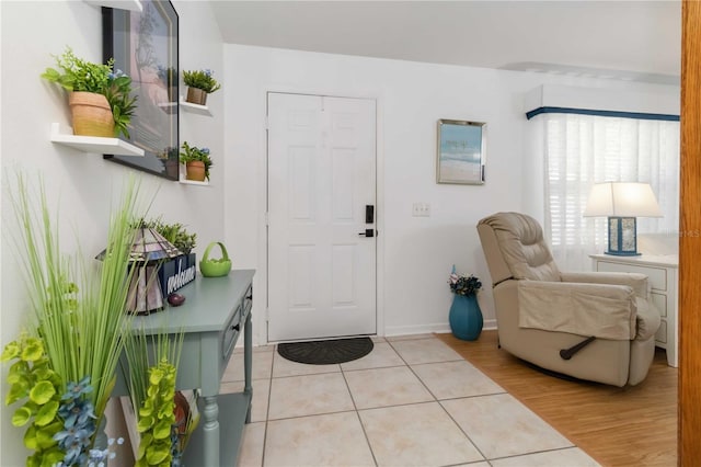 1804 W Shores Rd, Melbourne, FL 32935 - foyer featuring light tile patterned floors and baseboards