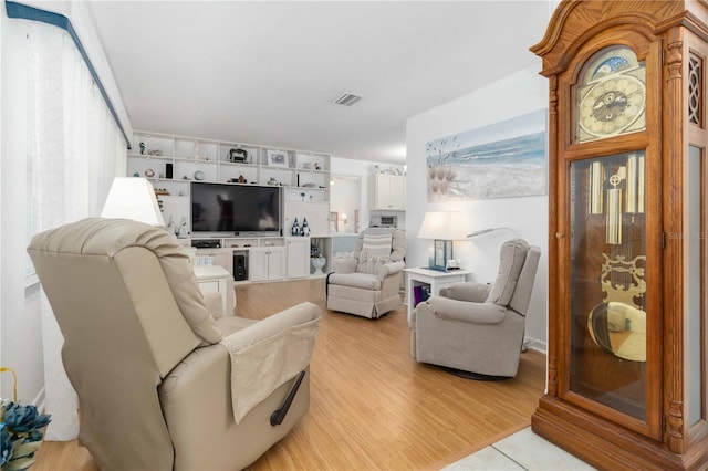 1804 W Shores Rd, Melbourne, FL 32935 - living room with light wood-style floors