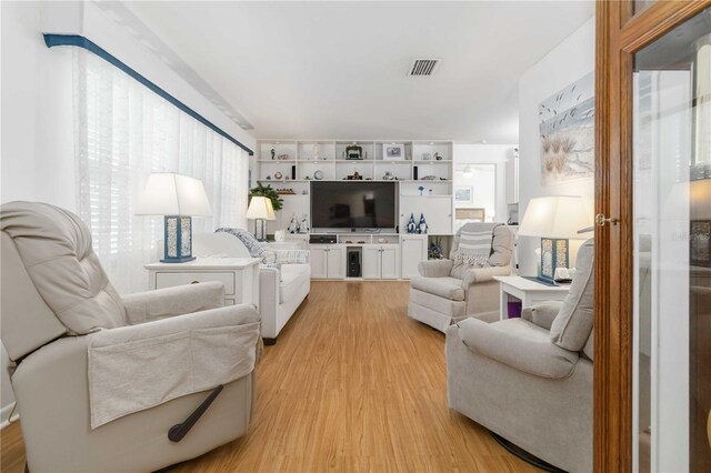 1804 W Shores Rd, Melbourne, FL 32935 - living area with light wood-style floors