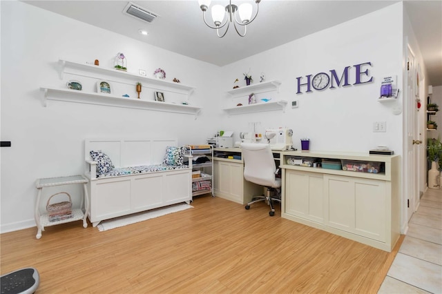 1804 W Shores Rd, Melbourne, FL 32935 - office area featuring light wood-style flooring, a chandelier, and built in desk