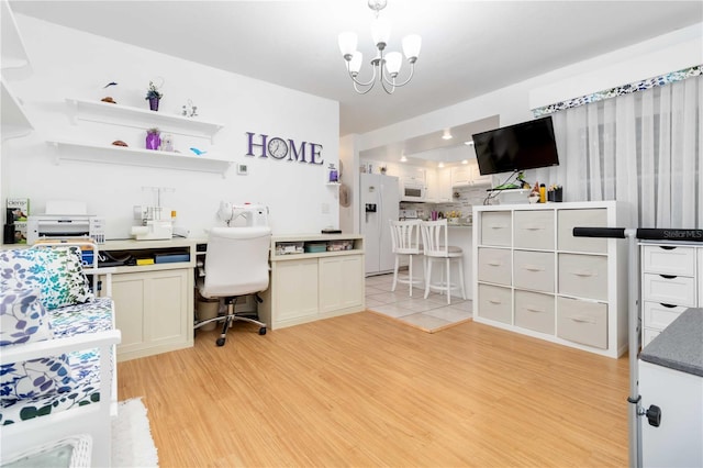 1804 W Shores Rd, Melbourne, FL 32935 - office featuring light wood-style flooring, a chandelier, and built in desk