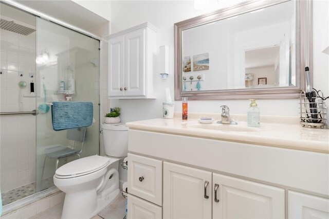 1804 W Shores Rd, Melbourne, FL 32935 - bathroom with toilet, a shower stall, vanity, and tile patterned floors