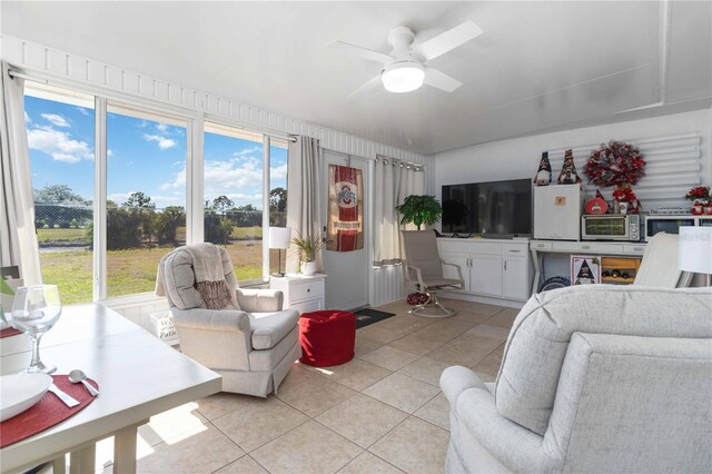 1804 W Shores Rd, Melbourne, FL 32935 - living area with light tile patterned flooring and ceiling fan
