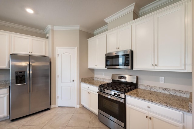 2532 Avolet Ct, Lakewood Ranch, FL 34211 - kitchen with appliances with stainless steel finishes, crown molding, white cabinets, and light stone counters