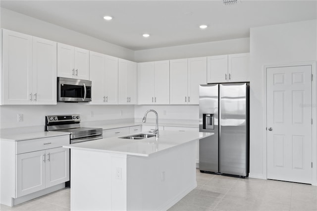 499 Silver Palm Dr, Haines City, FL 33844 - kitchen with appliances with stainless steel finishes, white cabinets, light countertops, and recessed lighting