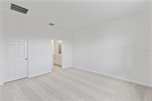 499 Silver Palm Dr, Haines City, FL 33844 - unfurnished bedroom with light colored carpet and connected bathroom