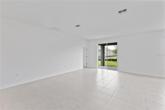 499 Silver Palm Dr, Haines City, FL 33844 - spare room featuring light tile patterned floors and baseboards