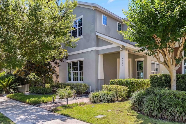 8160 Iron Mountain Trl, Windermere, FL 34786 - view of front facade with stucco siding and a front lawn