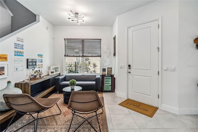 8160 Iron Mountain Trl, Windermere, FL 34786 - entryway with light tile patterned floors, baseboards, and a chandelier