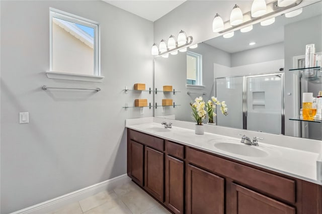 8160 Iron Mountain Trl, Windermere, FL 34786 - full bath with a stall shower, tile patterned flooring, baseboards, and double vanity