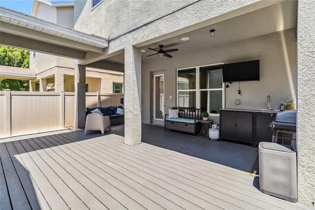 8160 Iron Mountain Trl, Windermere, FL 34786 - deck with fence, an outdoor hangout area, a ceiling fan, grilling area, and a sink