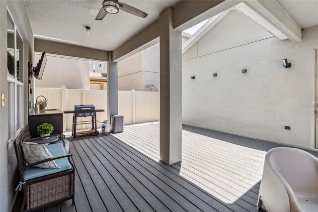 8160 Iron Mountain Trl, Windermere, FL 34786 - wooden terrace with a ceiling fan, fence, and grilling area