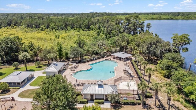 8160 Iron Mountain Trl, Windermere, FL 34786 - drone / aerial view of a pool, a heavily wooded area, and a nearby body of water