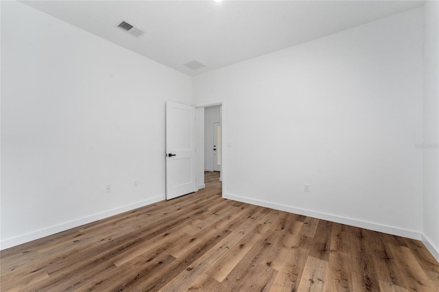7104 N Maltese Dr, Citrus Springs, FL 34433 - unfurnished room featuring wood finished floors and baseboards