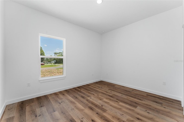 7104 N Maltese Dr, Citrus Springs, FL 34433 - unfurnished room with wood finished floors, baseboards, and recessed lighting