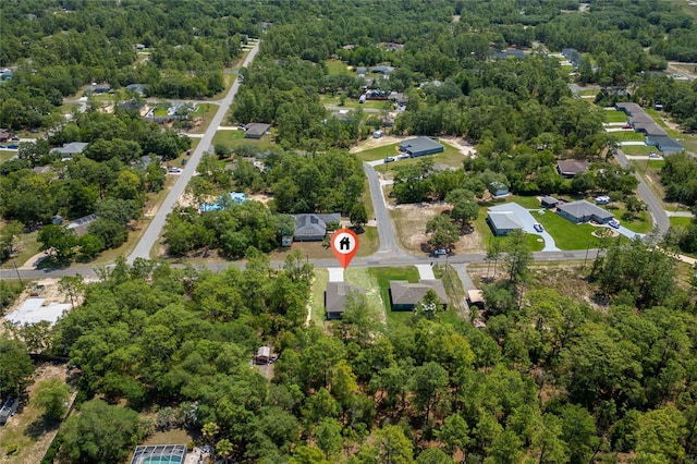 7104 N Maltese Dr, Citrus Springs, FL 34433 - aerial view of property and surrounding area featuring a forest