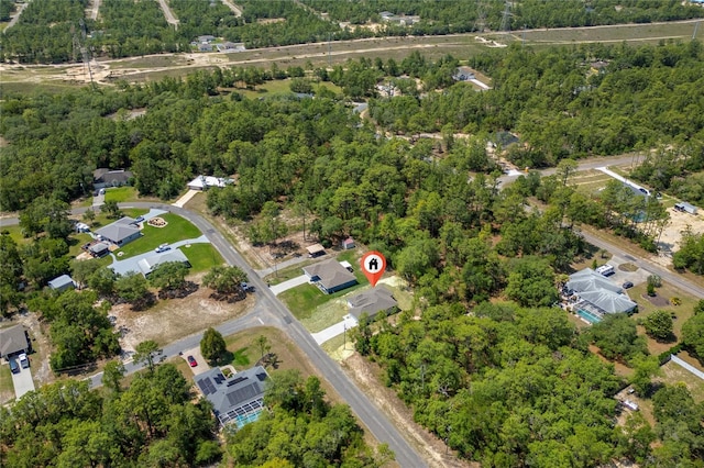 7104 N Maltese Dr, Citrus Springs, FL 34433 - aerial view of property and surrounding area with a heavily wooded area