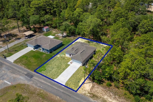 7104 N Maltese Dr, Citrus Springs, FL 34433 - view from above of property featuring property parcel outlined and a forest