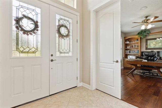 724 Duff Dr, Winter Garden, FL 34787 - entryway with a ceiling fan, light tile patterned floors, and baseboards