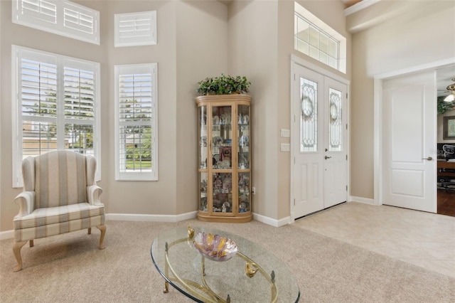 724 Duff Dr, Winter Garden, FL 34787 - carpeted foyer with a high ceiling and baseboards