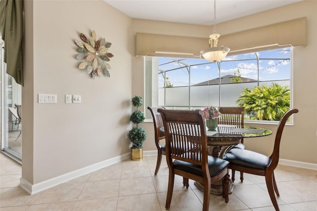724 Duff Dr, Winter Garden, FL 34787 - dining room with a sunroom, baseboards, and light tile patterned floors