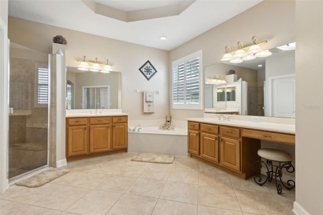 724 Duff Dr, Winter Garden, FL 34787 - full bathroom with a garden tub, a stall shower, two vanities, and tile patterned floors