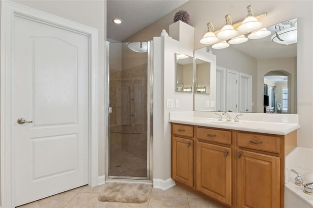 724 Duff Dr, Winter Garden, FL 34787 - bathroom featuring a stall shower, vanity, tile patterned flooring, and baseboards