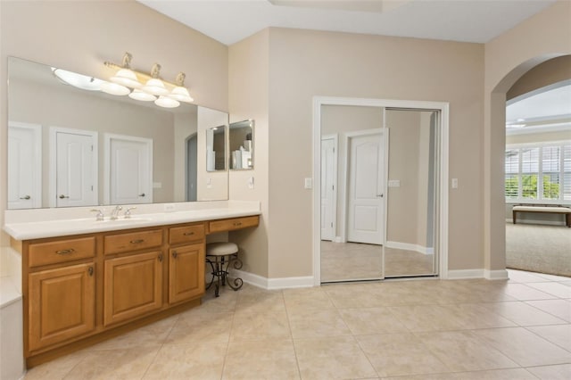 724 Duff Dr, Winter Garden, FL 34787 - bathroom with vanity, tile patterned flooring, and baseboards