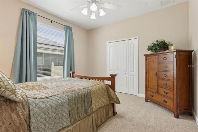 724 Duff Dr, Winter Garden, FL 34787 - bedroom with light carpet, a closet, ceiling fan, and baseboards