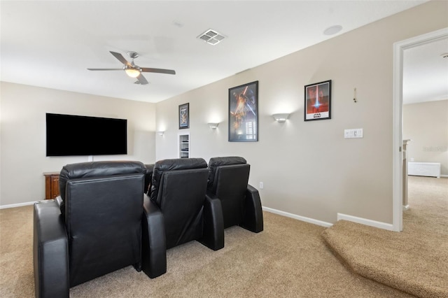 724 Duff Dr, Winter Garden, FL 34787 - home theater room with light carpet, a ceiling fan, and baseboards